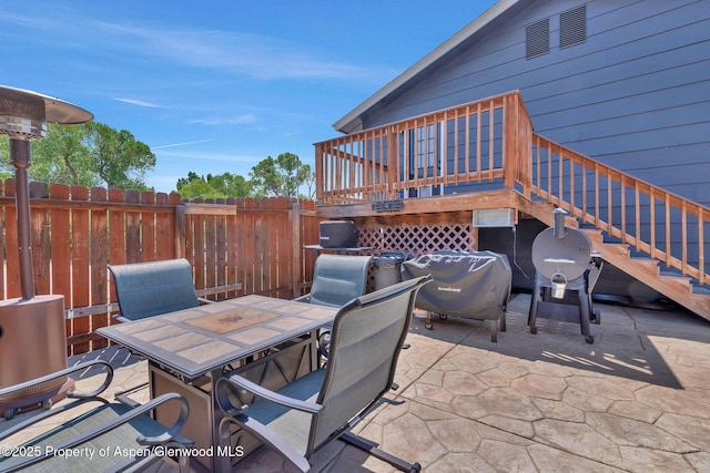 1186 Washington St, Craig, CO 81625 - view of patio featuring outdoor dining area, grilling area, and a wooden deck