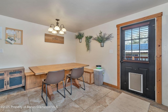 1186 Washington St, Craig, CO 81625 - dining room featuring a chandelier and baseboards