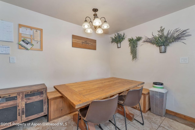 1186 Washington St, Craig, CO 81625 - dining room with a chandelier and tile patterned floors