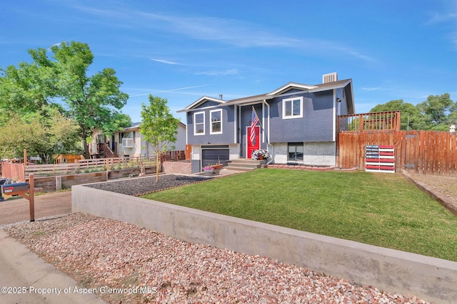 1186 Washington St, Craig, CO 81625 - raised ranch featuring a garage, driveway, and brick siding