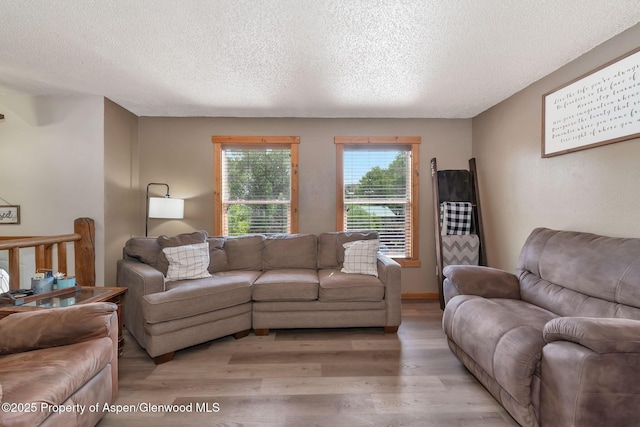 1186 Washington St, Craig, CO 81625 - living room featuring light wood-style floors and a textured ceiling