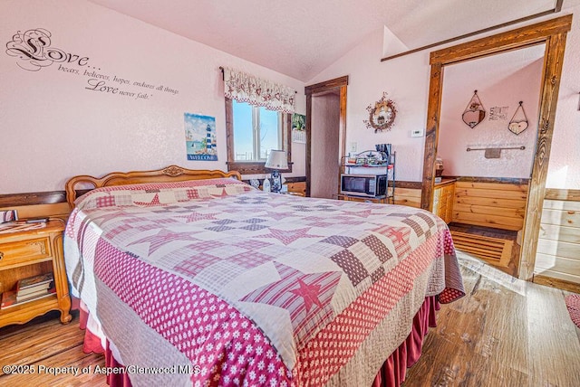 37 Pronghorn Rd, Craig, CO 81625 - bedroom with lofted ceiling and wood finished floors