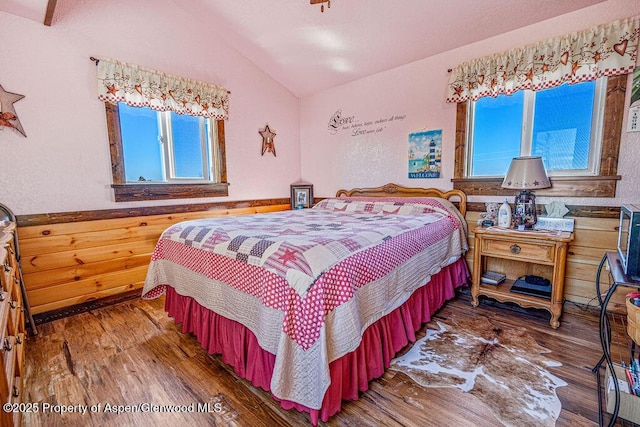 37 Pronghorn Rd, Craig, CO 81625 - bedroom featuring vaulted ceiling, wood-type flooring, and multiple windows