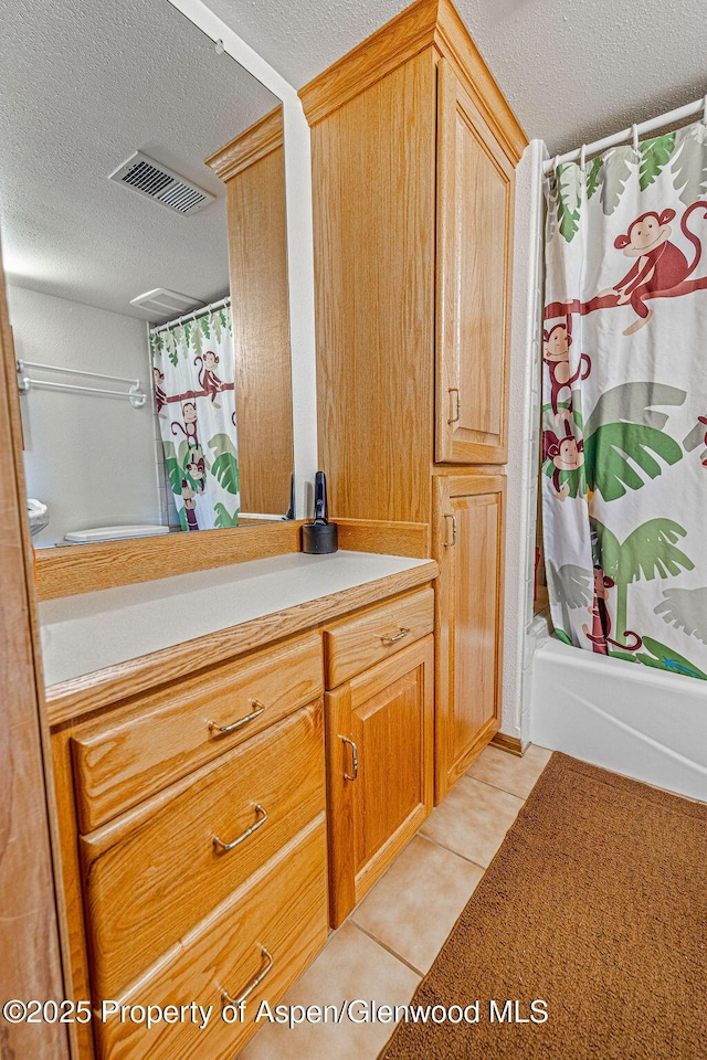 37 Pronghorn Rd, Craig, CO 81625 - bathroom featuring a textured ceiling, vanity, tile patterned floors, and shower / bath combination with curtain