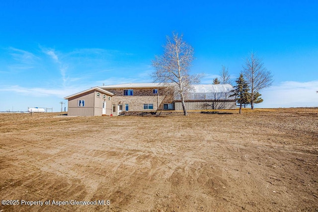 37 Pronghorn Rd, Craig, CO 81625 - back of property featuring stone siding
