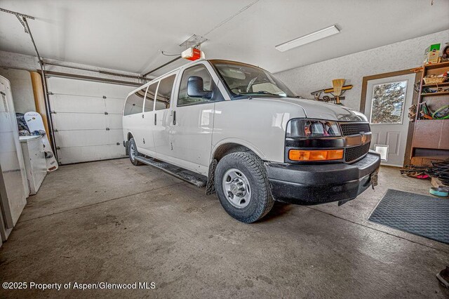37 Pronghorn Rd, Craig, CO 81625 - garage featuring a garage door opener