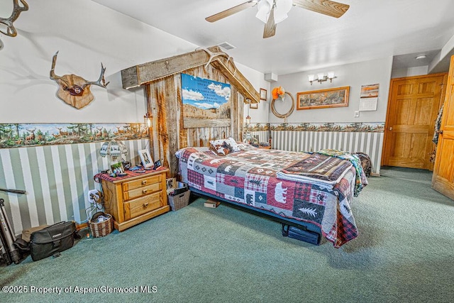 37 Pronghorn Rd, Craig, CO 81625 - carpeted bedroom featuring ceiling fan and a chandelier