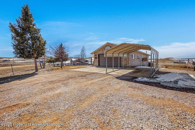 37 Pronghorn Rd, Craig, CO 81625 - view of outbuilding with a carport and dirt driveway