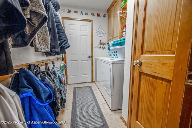 37 Pronghorn Rd, Craig, CO 81625 - laundry area with washer and dryer, cabinet space, and light tile patterned flooring