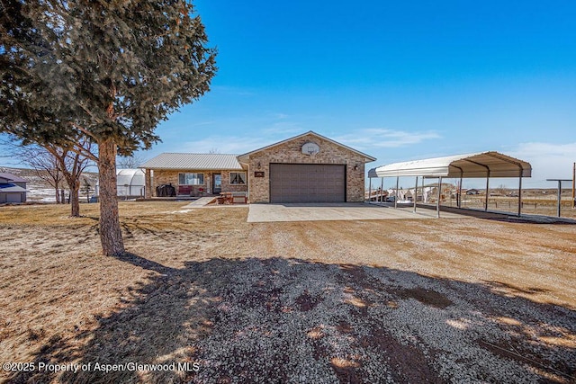 37 Pronghorn Rd, Craig, CO 81625 - ranch-style house with a garage, driveway, brick siding, a carport, and a metal roof