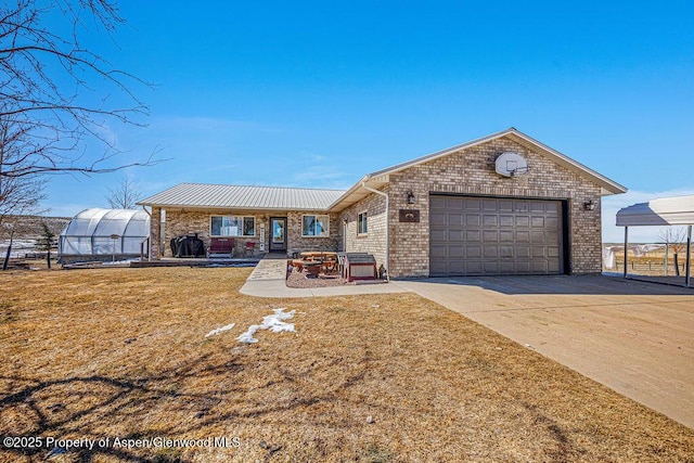 37 Pronghorn Rd, Craig, CO 81625 - single story home featuring an exterior structure, brick siding, driveway, a garage, and a front yard