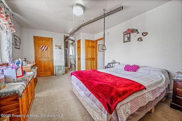 37 Pronghorn Rd, Craig, CO 81625 - bedroom featuring light carpet, ensuite bathroom, and ceiling fan