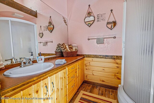 37 Pronghorn Rd, Craig, CO 81625 - bathroom with wood finished floors, vanity, and a shower