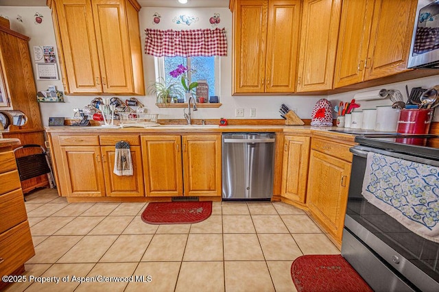37 Pronghorn Rd, Craig, CO 81625 - kitchen with stainless steel appliances, light countertops, light tile patterned floors, and brown cabinetry