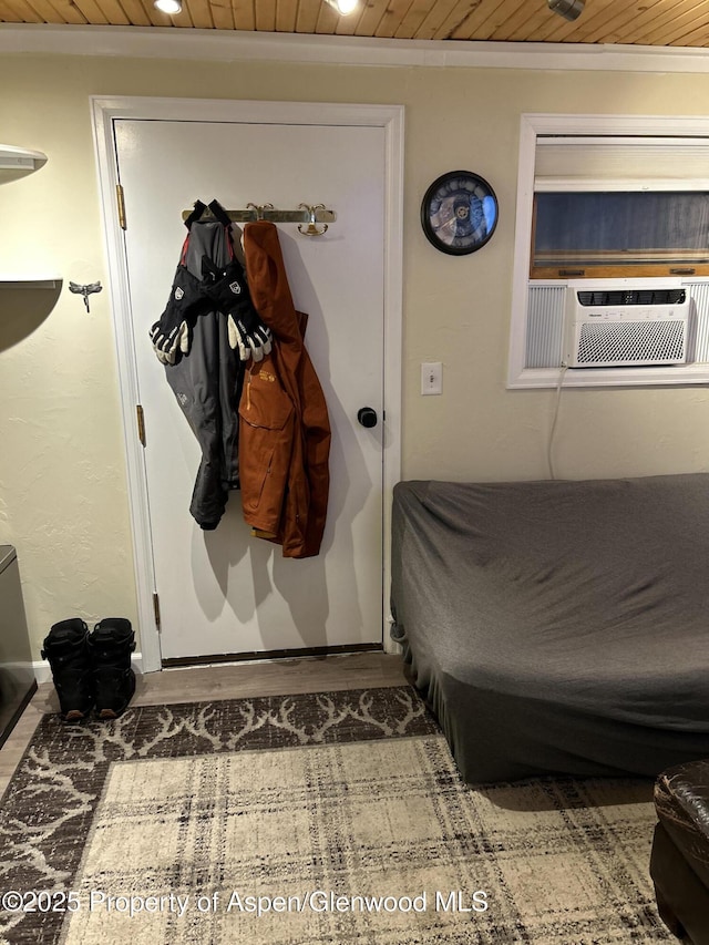 bedroom featuring crown molding, cooling unit, and wood ceiling