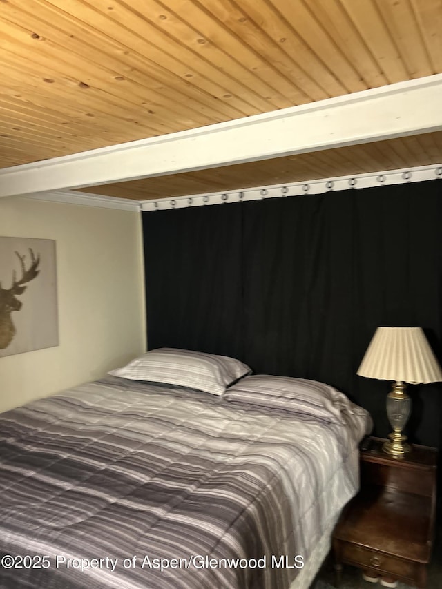 bedroom featuring wood ceiling