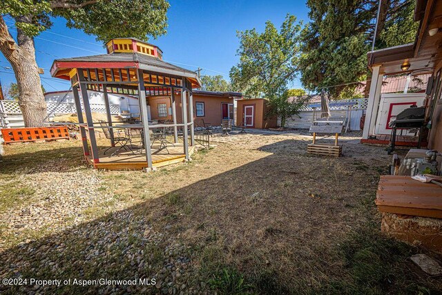 view of yard featuring a shed and a deck