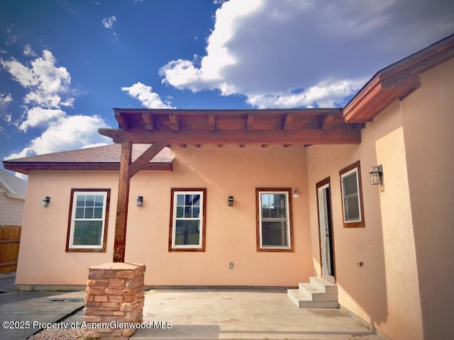 1279 E 17th St, Rifle, CO 81650 - doorway to property with stucco siding and a patio