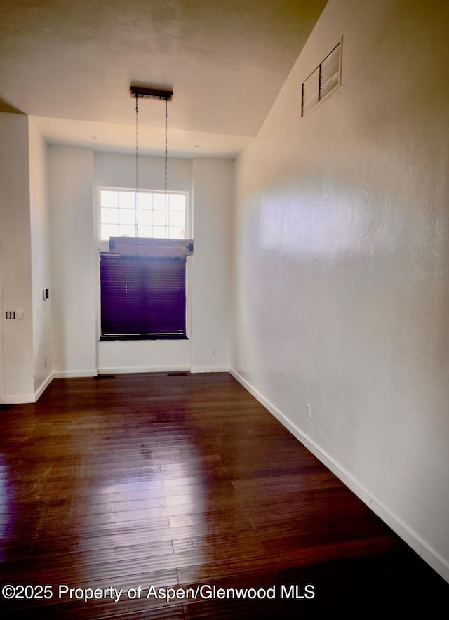 1279 E 17th St, Rifle, CO 81650 - spare room featuring wood-type flooring and baseboards