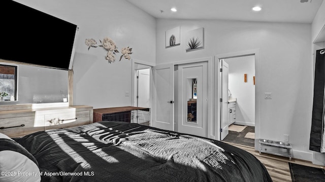 450 E 10th St, Rifle, CO 81650 - bedroom featuring baseboards, high vaulted ceiling, wood finished floors, and recessed lighting