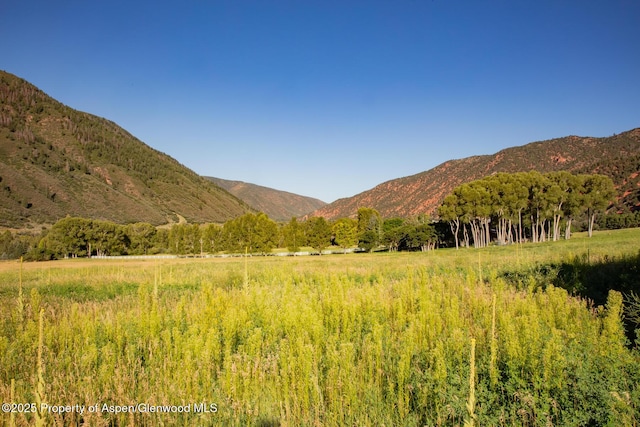 mountain view featuring a rural view