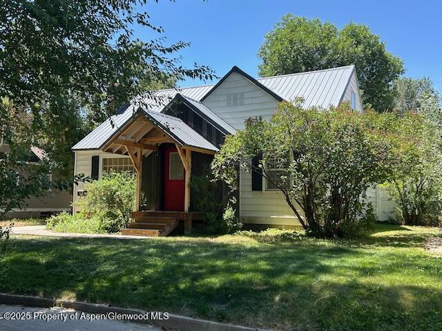 624 Barclay St, Craig, CO 81625 - view of front facade with a front lawn and a metal roof