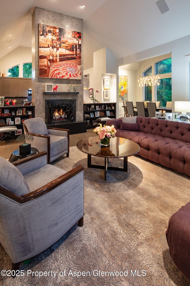205 N 6th St, Aspen, CO 81611 - living room featuring vaulted ceiling, a fireplace, and a chandelier