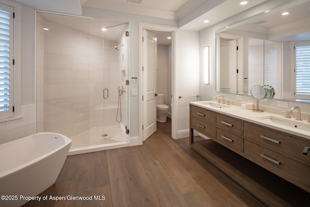 205 N 6th St, Aspen, CO 81611 - full bathroom with a stall shower, double vanity, wood finished floors, crown molding, and a freestanding bath