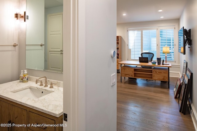 205 N 6th St, Aspen, CO 81611 - bathroom with wood finished floors, vanity, and recessed lighting