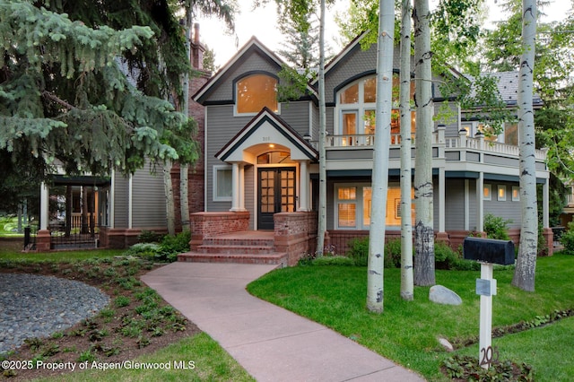 205 N 6th St, Aspen, CO 81611 - view of front of property with a balcony, a front yard, and french doors