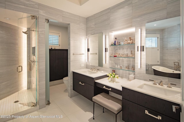 205 N 6th St, Aspen, CO 81611 - full bath with tile walls, a stall shower, tile patterned floors, vanity, and healthy amount of natural light