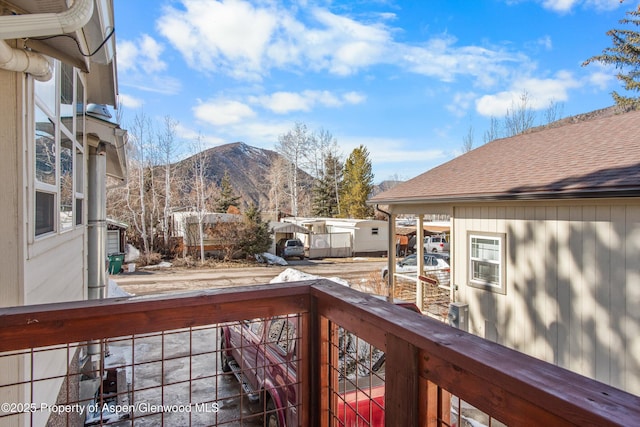 wooden deck featuring a mountain view