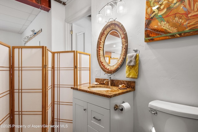 bathroom featuring toilet and vanity