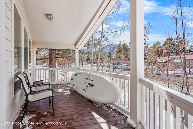 view of snow covered deck