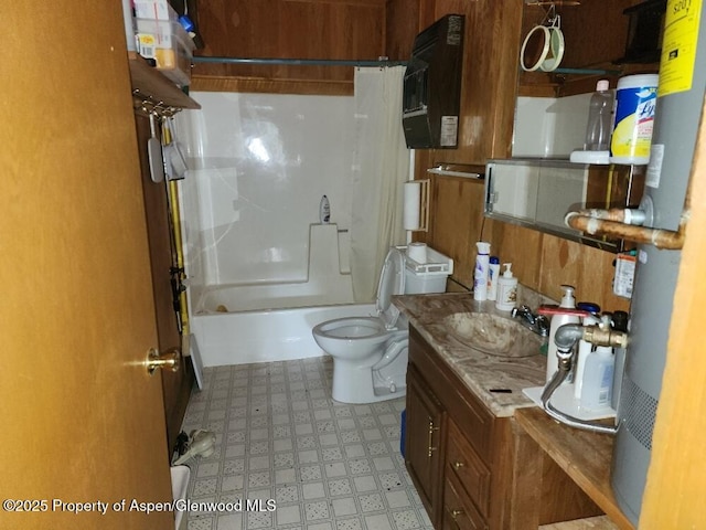 bathroom featuring vanity, tile patterned floors, bathing tub / shower combination, and toilet