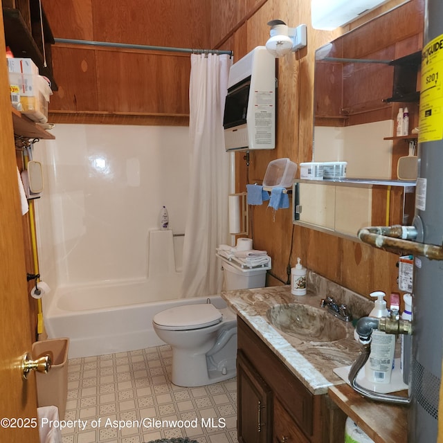 full bathroom featuring vanity, tile patterned floors, shower / bath combo, and toilet