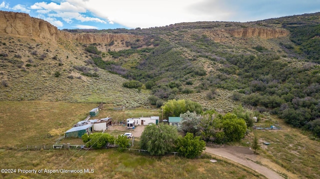 birds eye view of property with a mountain view