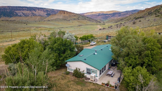 birds eye view of property with a mountain view