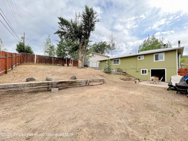 1111 Barclay St, Craig, CO 81625 - fenced backyard featuring a patio
