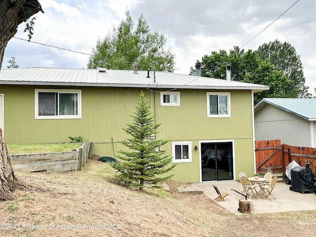 1111 Barclay St, Craig, CO 81625 - back of house with a patio, a metal roof, and a gate