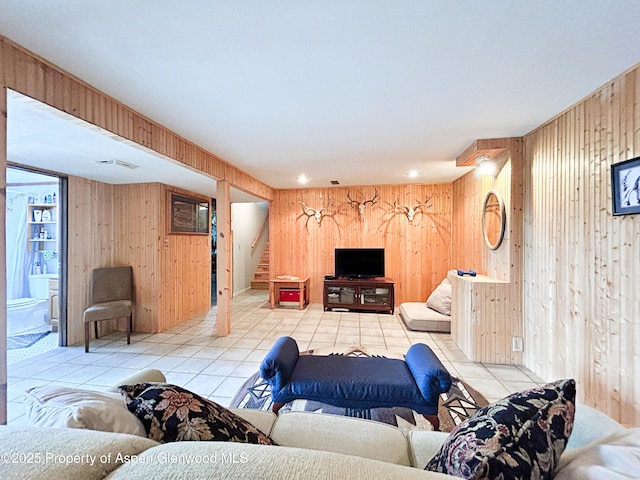 1111 Barclay St, Craig, CO 81625 - tiled living area with wooden walls and stairway