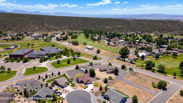 325 SE Cobblestone Ct, Cedaredge, CO 81413 - aerial perspective of suburban area with a mountainous background