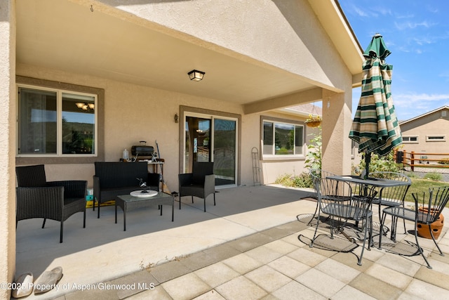 325 SE Cobblestone Ct, Cedaredge, CO 81413 - view of patio with an outdoor hangout area and outdoor dining space