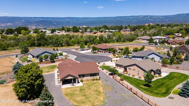 325 SE Cobblestone Ct, Cedaredge, CO 81413 - aerial perspective of suburban area featuring a mountainous background