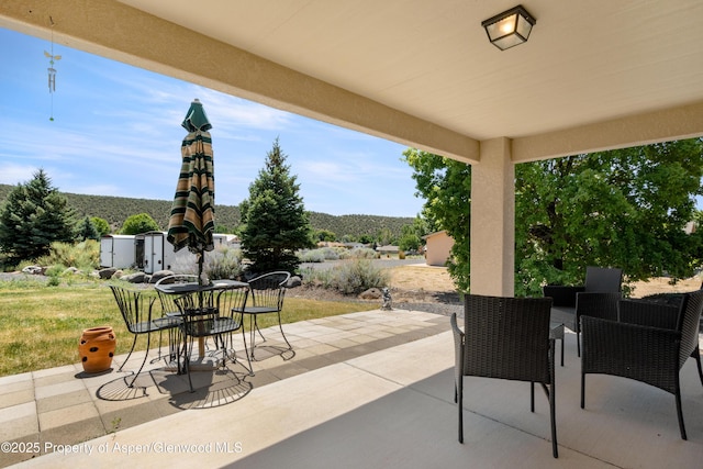 325 SE Cobblestone Ct, Cedaredge, CO 81413 - view of patio / terrace with outdoor dining space
