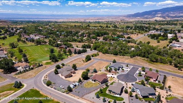 325 SE Cobblestone Ct, Cedaredge, CO 81413 - aerial overview of property's location with mountains and nearby suburban area