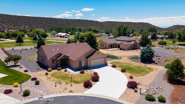 325 SE Cobblestone Ct, Cedaredge, CO 81413 - aerial perspective of suburban area featuring mountains