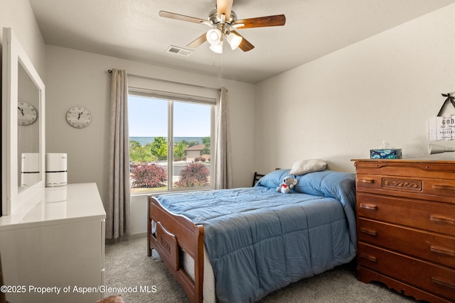 325 SE Cobblestone Ct, Cedaredge, CO 81413 - bedroom featuring light colored carpet and ceiling fan