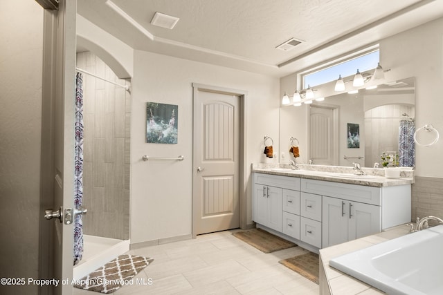 325 SE Cobblestone Ct, Cedaredge, CO 81413 - bathroom featuring double vanity, a tile shower, and tiled bath