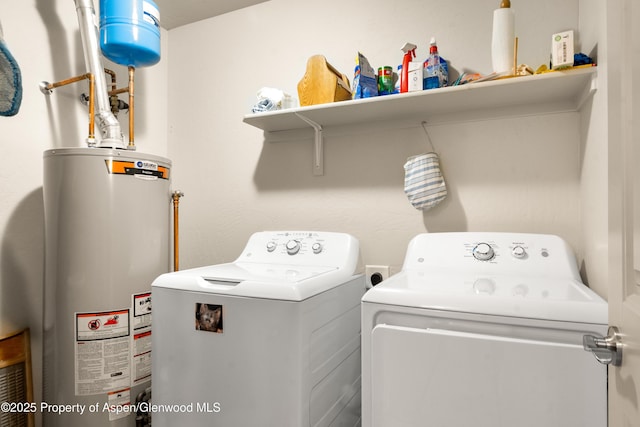 325 SE Cobblestone Ct, Cedaredge, CO 81413 - washroom featuring gas water heater and washer and clothes dryer